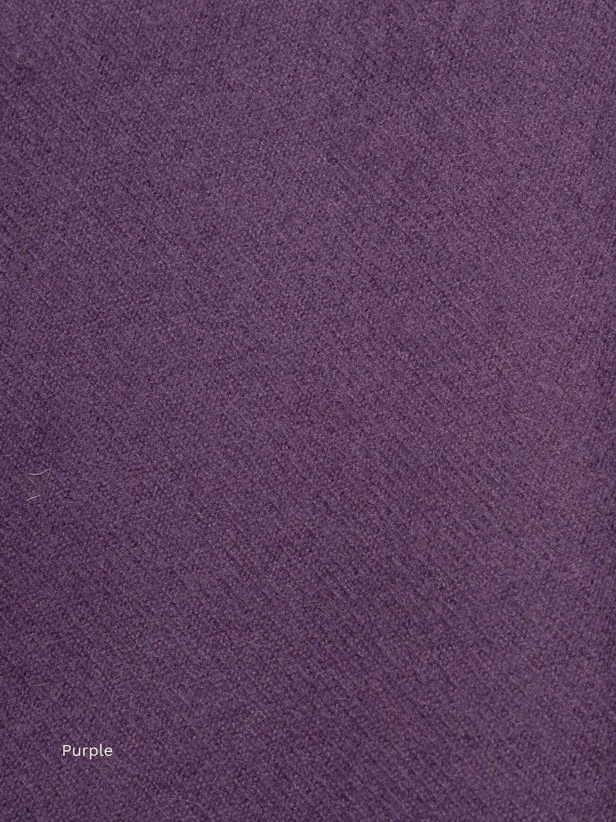 Purple naturally dyed baby alpaca scarf, close-up of the soft plum fabric