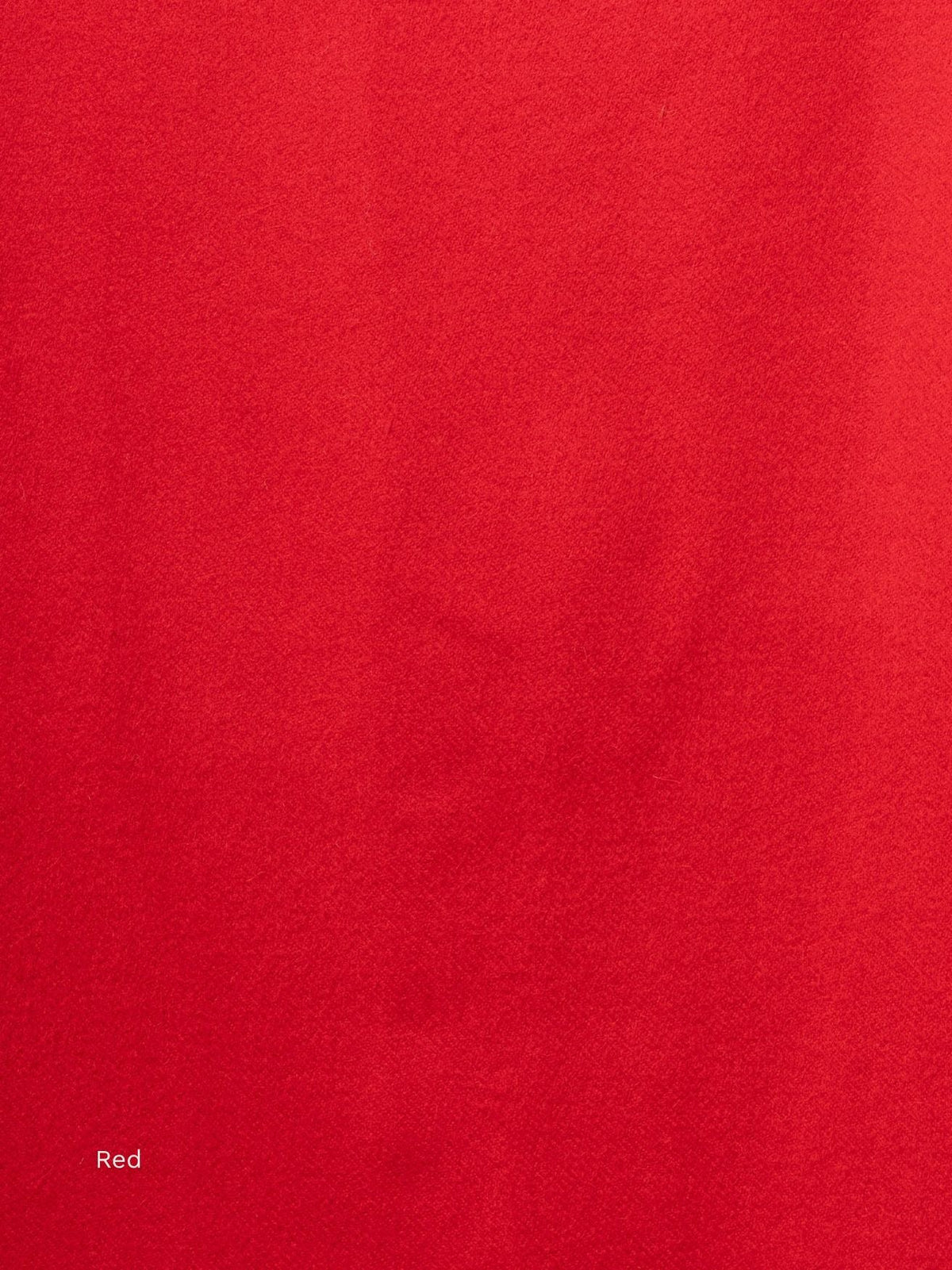 Red naturally dyed baby alpaca scarf, close-up of the bright red soft fabric