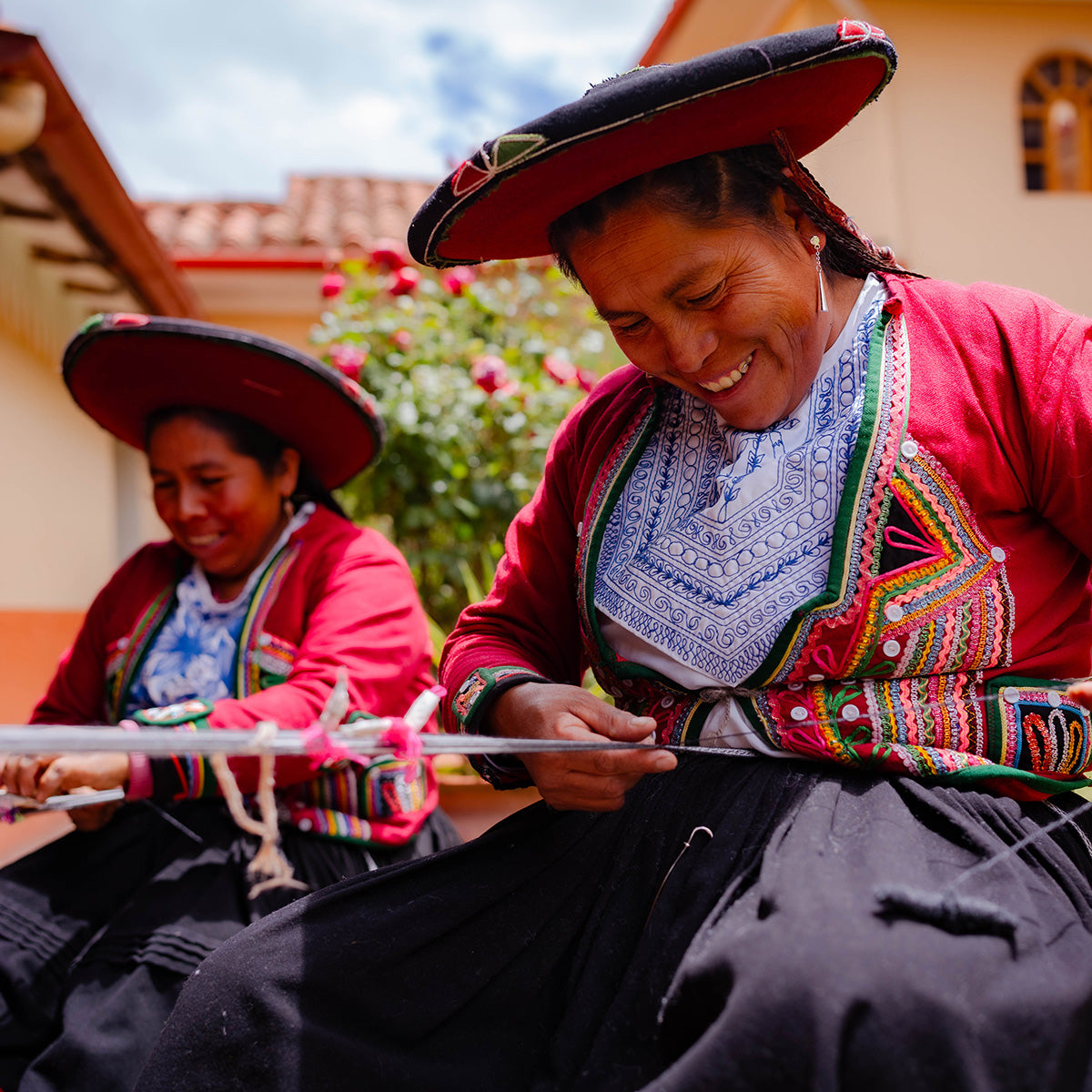 The skilled hands of Peruvian women artisans, weaving the story of Orange Inca.