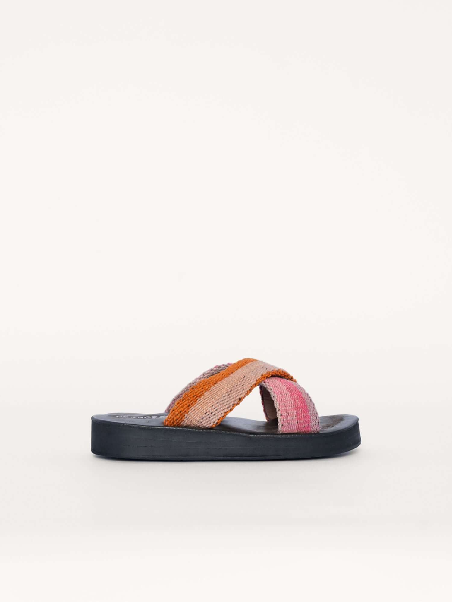 Washed pink and orange wool x sandals for women with leather soles, side view.
