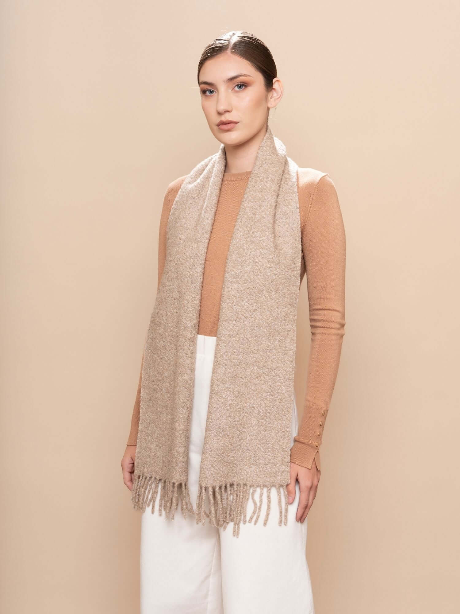 Model wearing undyed bouclé scarf in oatmeal, baby alpaca silk blend with soft drape and natural texture
