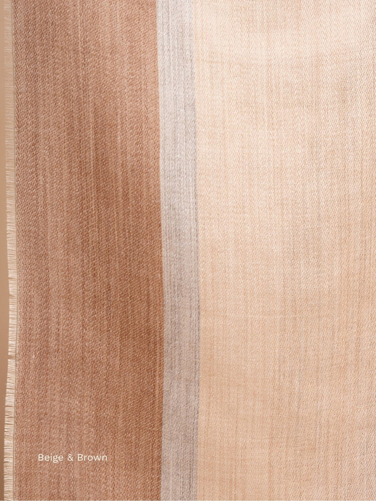 Close-up of the beige and camel stripes on a silk baby alpaca blend shawl, fine lustrous weave