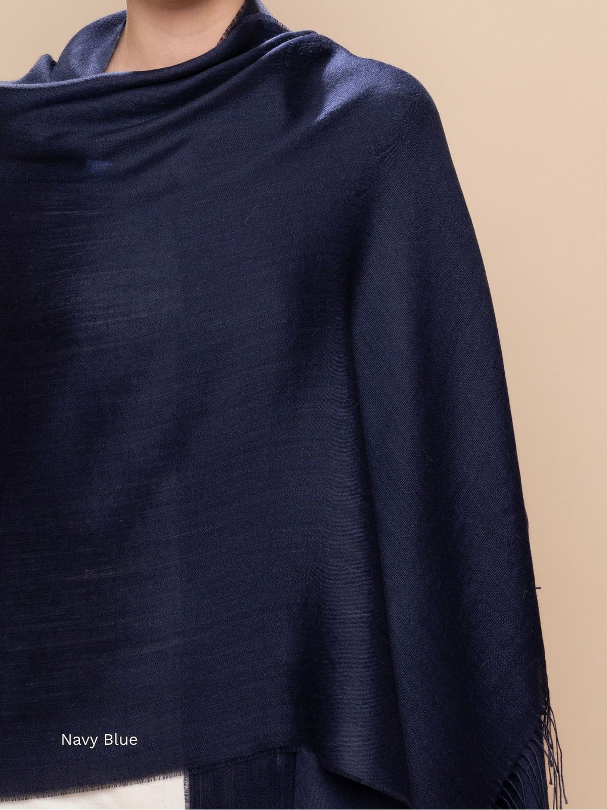 Navy blue silk baby alpaca blend shawl draped around the shoulders, deep solid blue wrap