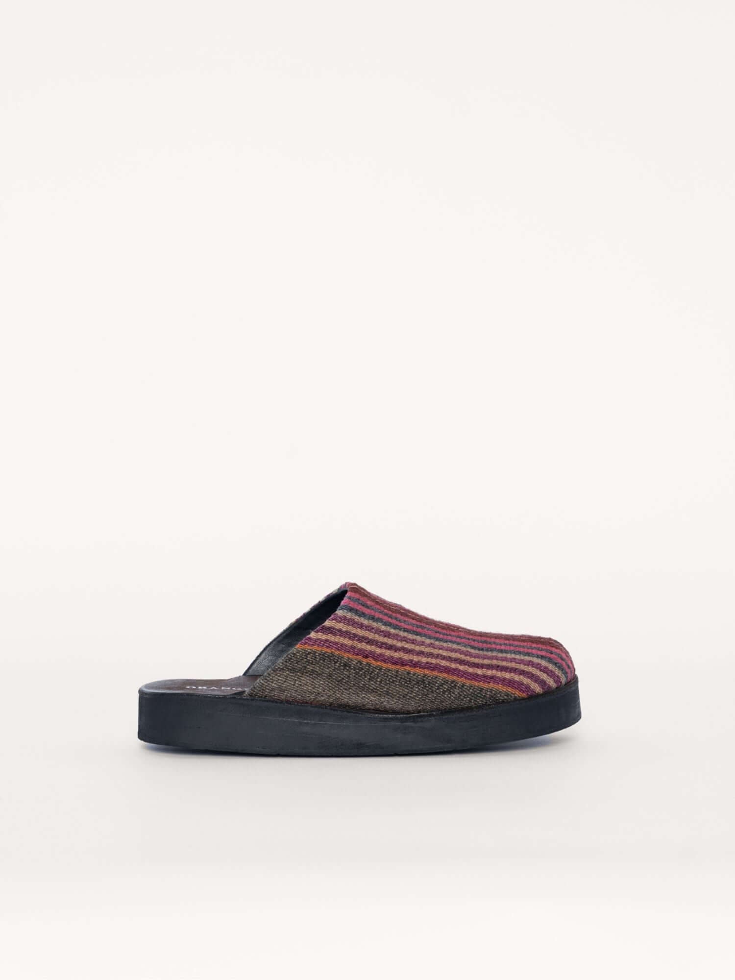 Striped wool and leather clogs for women and men in earthy tones, side view.