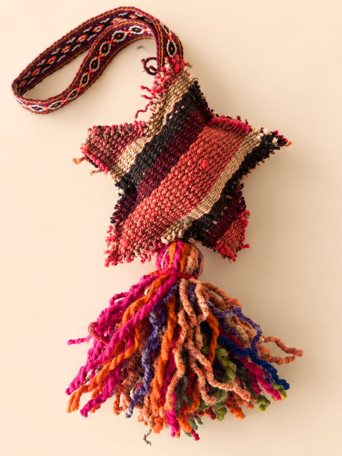 Large star wool tassel cut from naturally dyed Peruvian frazada, with a multicolour tassel – handmade bag charm | Tasselita by Orange Inca