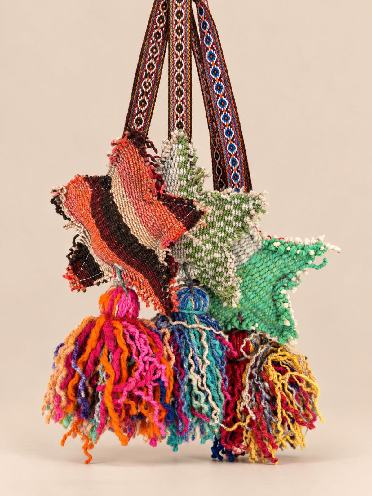 Group of large star wool tassels – every one cut from a different handwoven frazada | Tasselita by Orange Inca