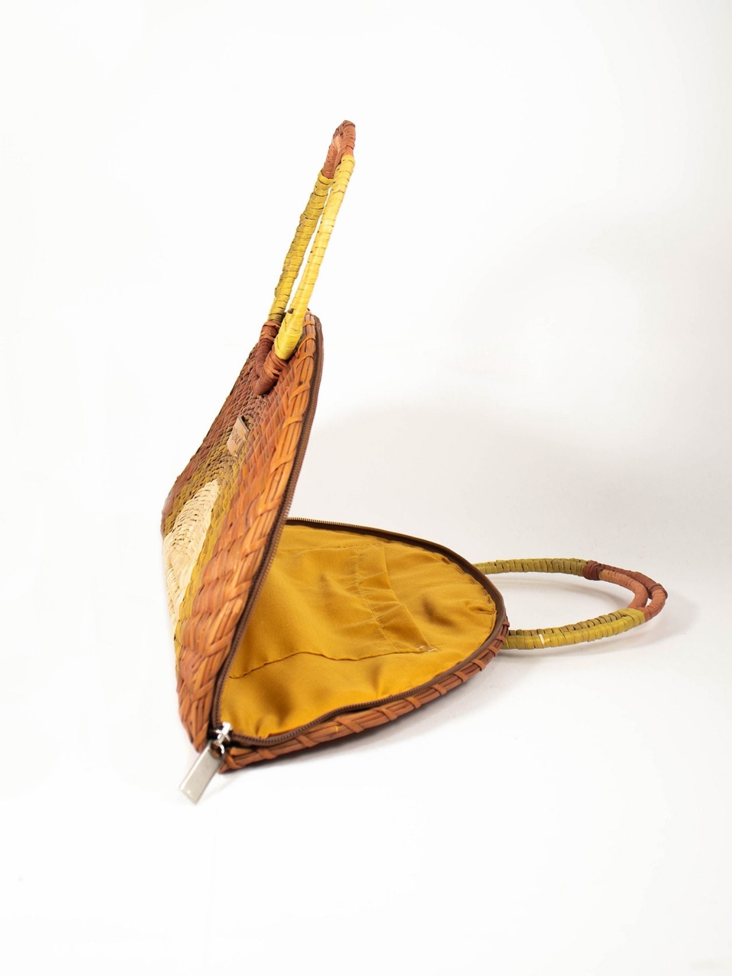 Flamenco Swing Clutch – Browns & Natural showing circular top handle detail | Orange Inca