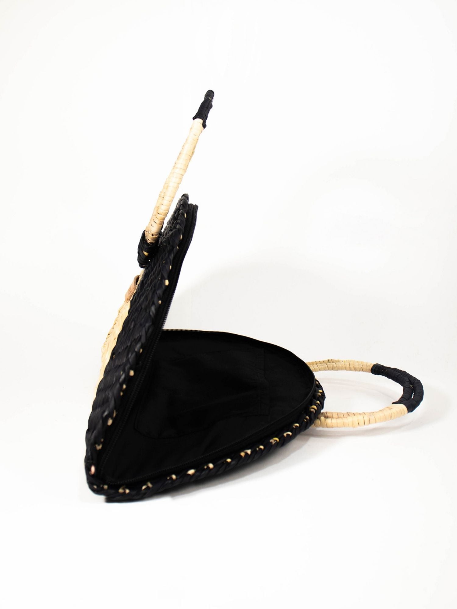 Flamenco Swing Clutch – Black & Natural showing circular top handle detail | Orange Inca