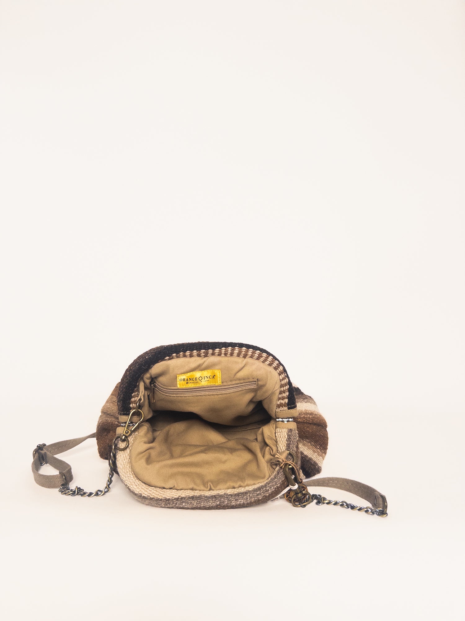 Interior of Luna kiss lock clutch in browns and ivory – beige cotton drill lining with zip pocket | Orange Inca