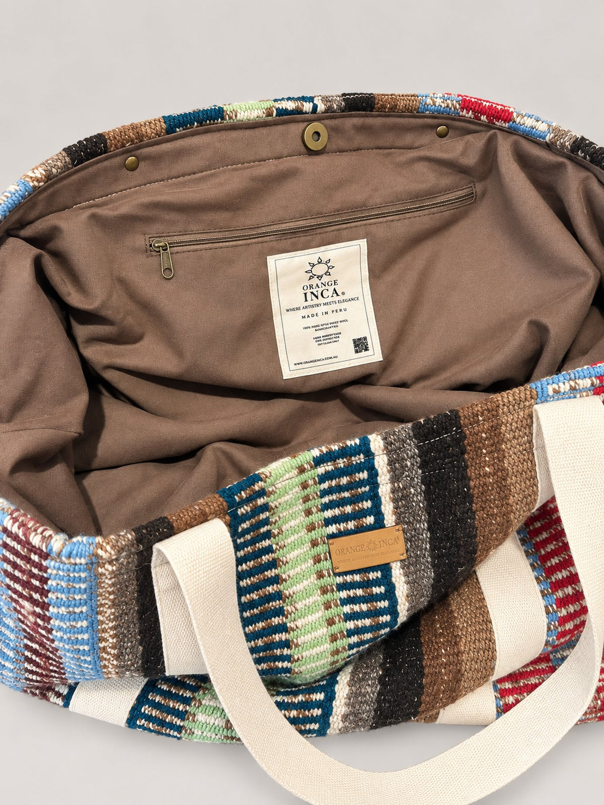 The Manta Carryall in Blue, Green and Berry Stripes — inside: lining, magnetic snap closure and zip pocket