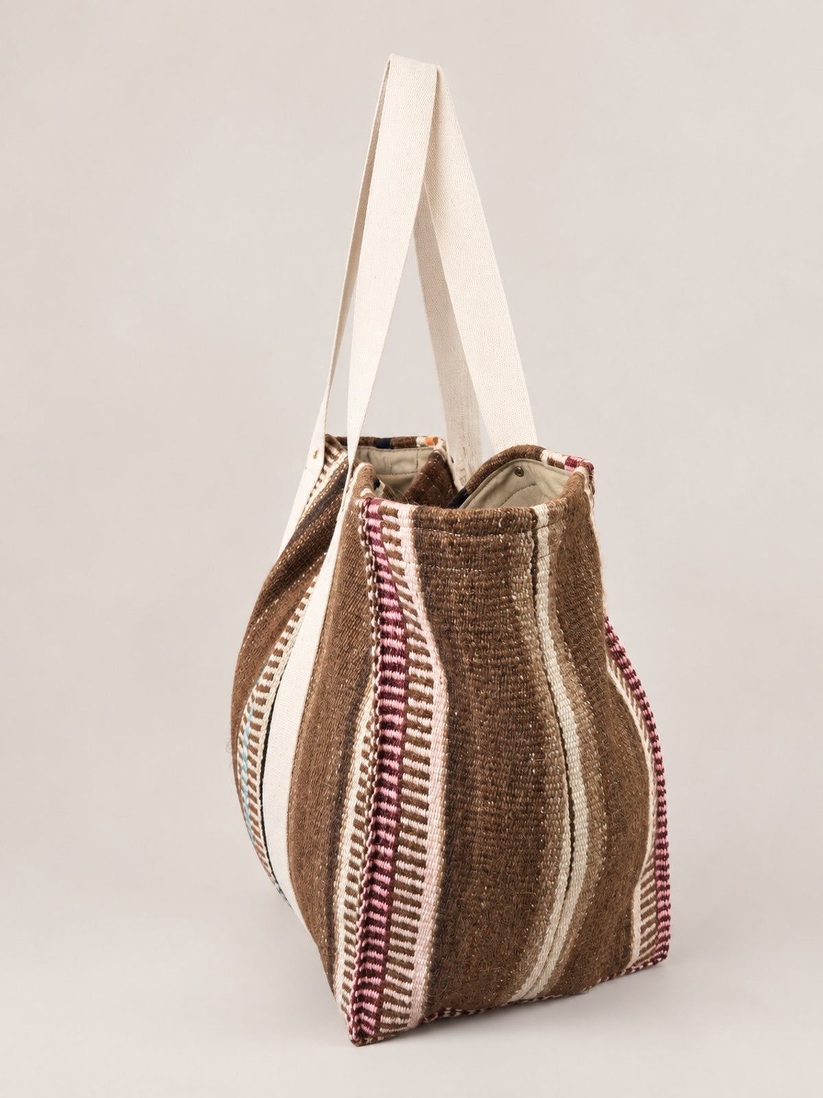 The Manta Carryall in Browns, Peach and Sky Blue — side view
