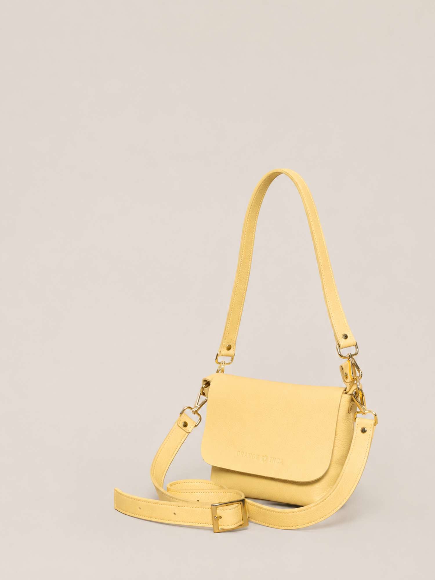 The Olivia Butter Yellow leather crossbody — both straps shown (shoulder + crossbody) | Orange Inca