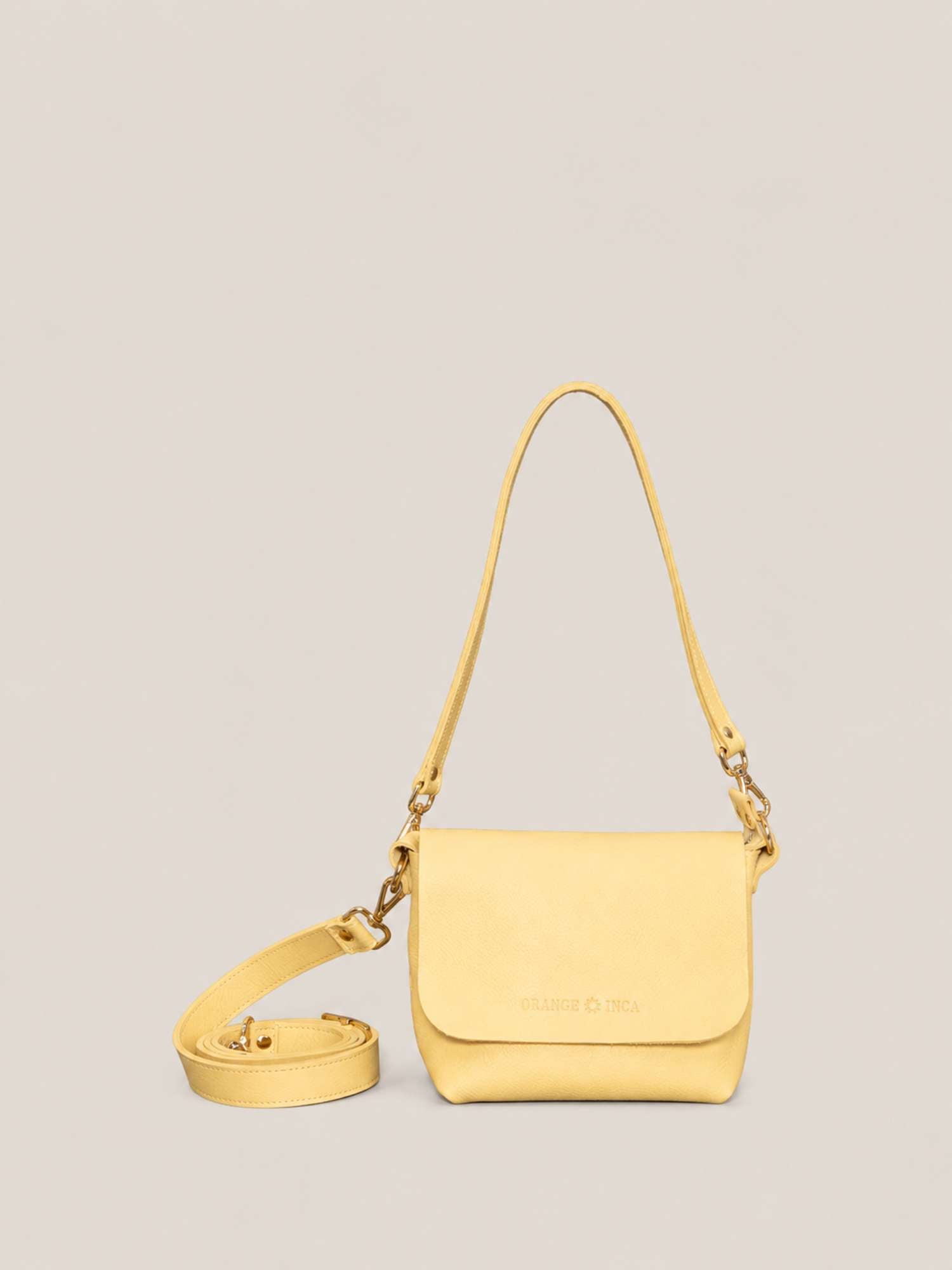 Butter Yellow full-grain leather crossbody by Orange Inca — front with strap coiled | Orange Inca