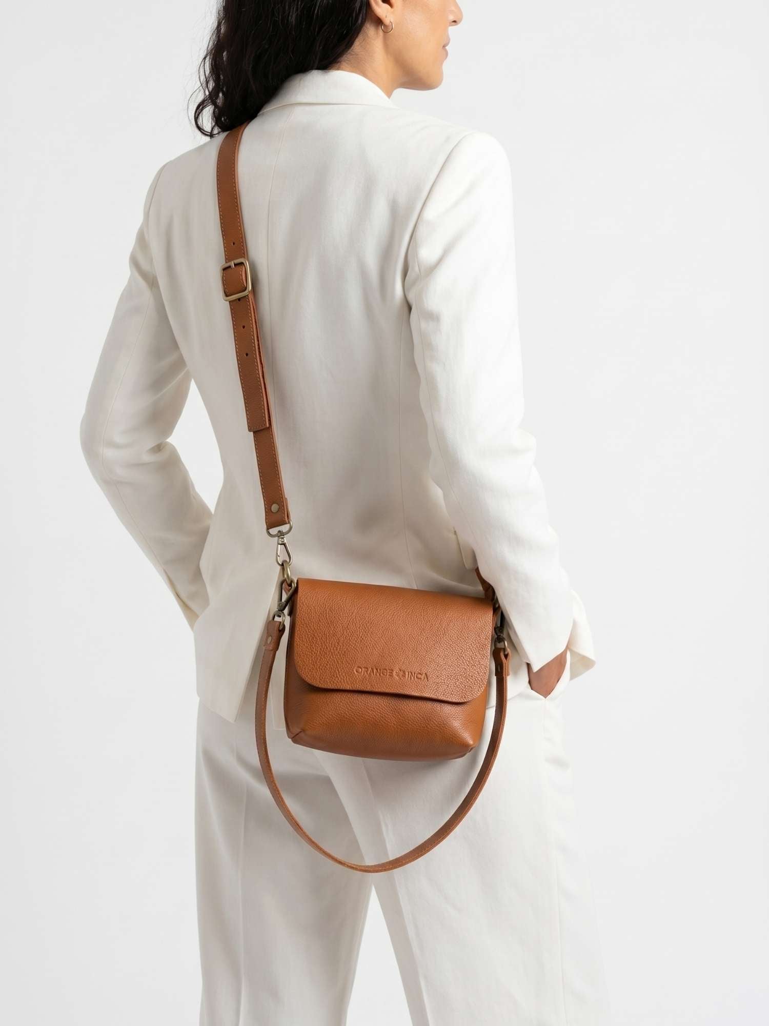 The Olivia Cognac leather crossbody — back view with both straps attached, full-grain leather | Orange Inca