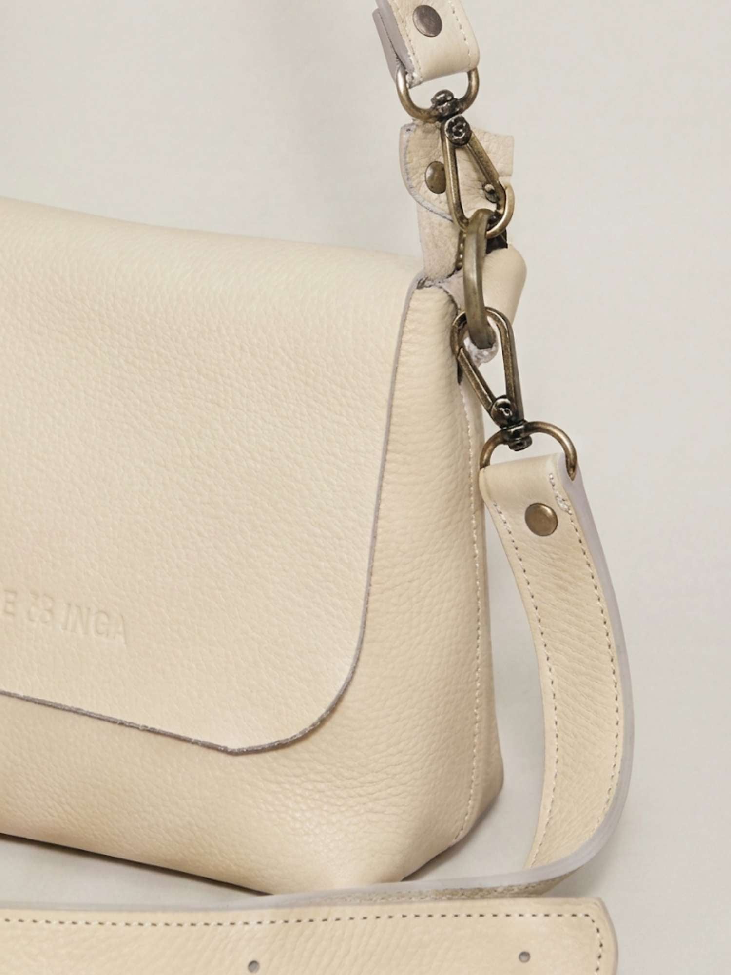 Ivory Olivia leather crossbody — alternative angle, removable straps, full-grain leather | Orange Inca