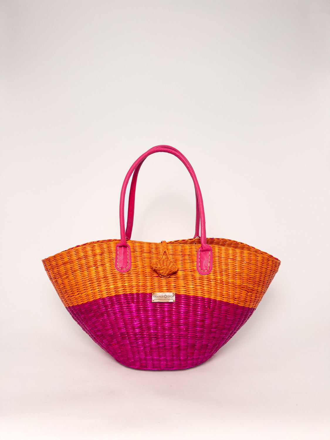 Playa Tote - Half Fuchsia Half Orange, handwoven junco tote bag, made with natural dyes and faux leather straps.