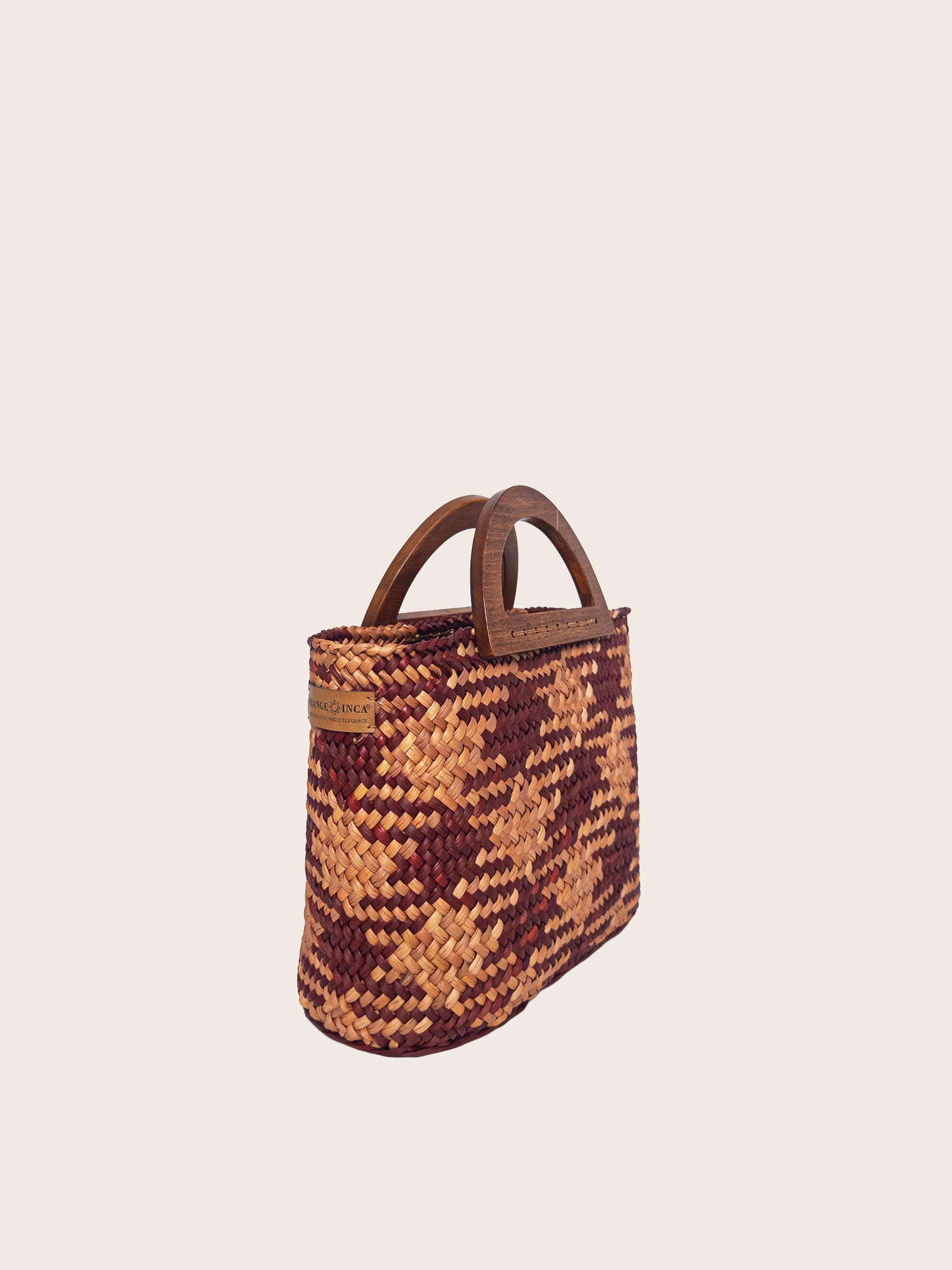 The Sophia handwoven bag in earthy tones of camel and beige with solid wood handles, stylish and spacious design.