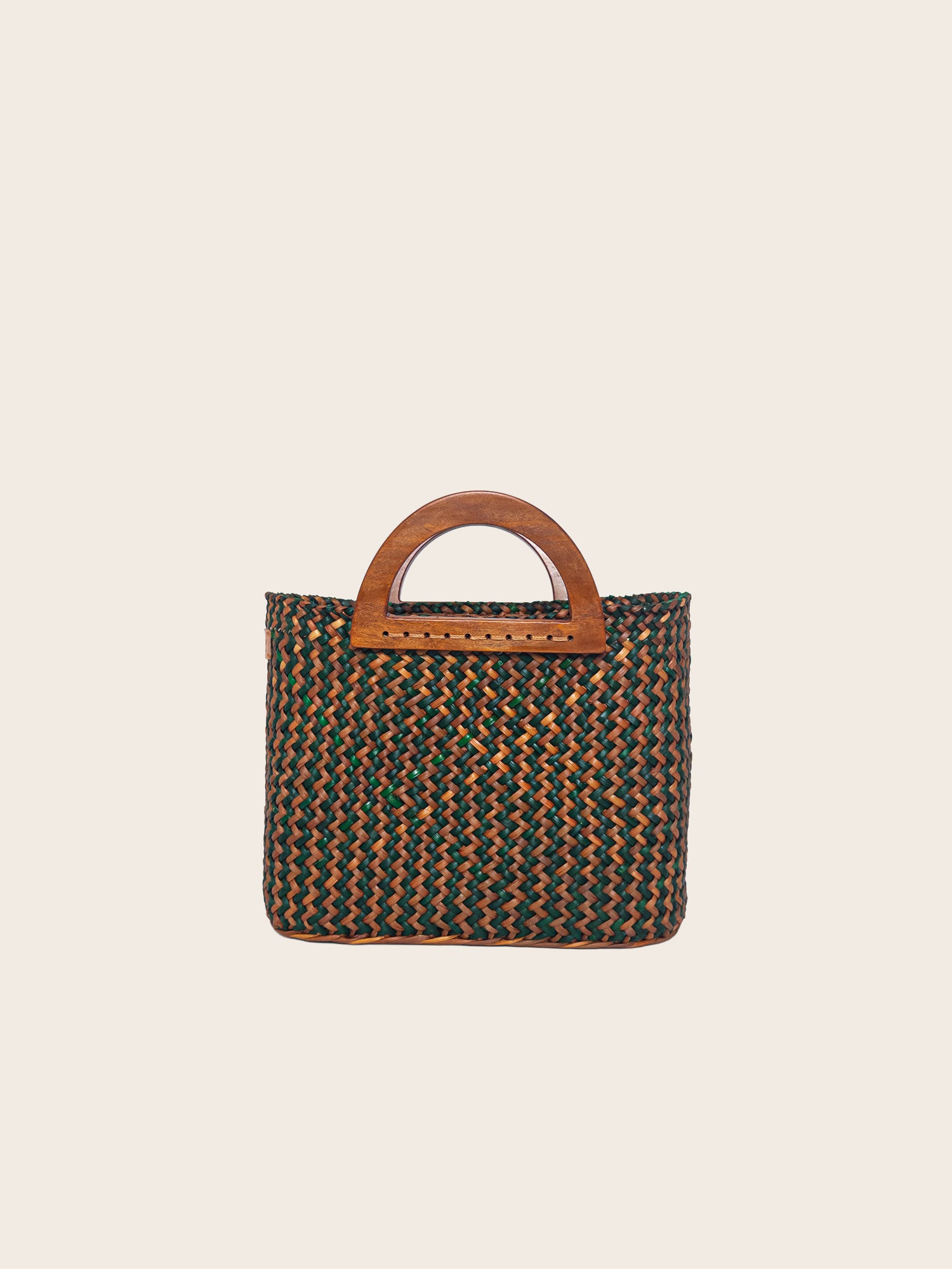 The Sophia bag in olive green and camel, handwoven with wooden handles, showcasing an earthy style and spacious interior.