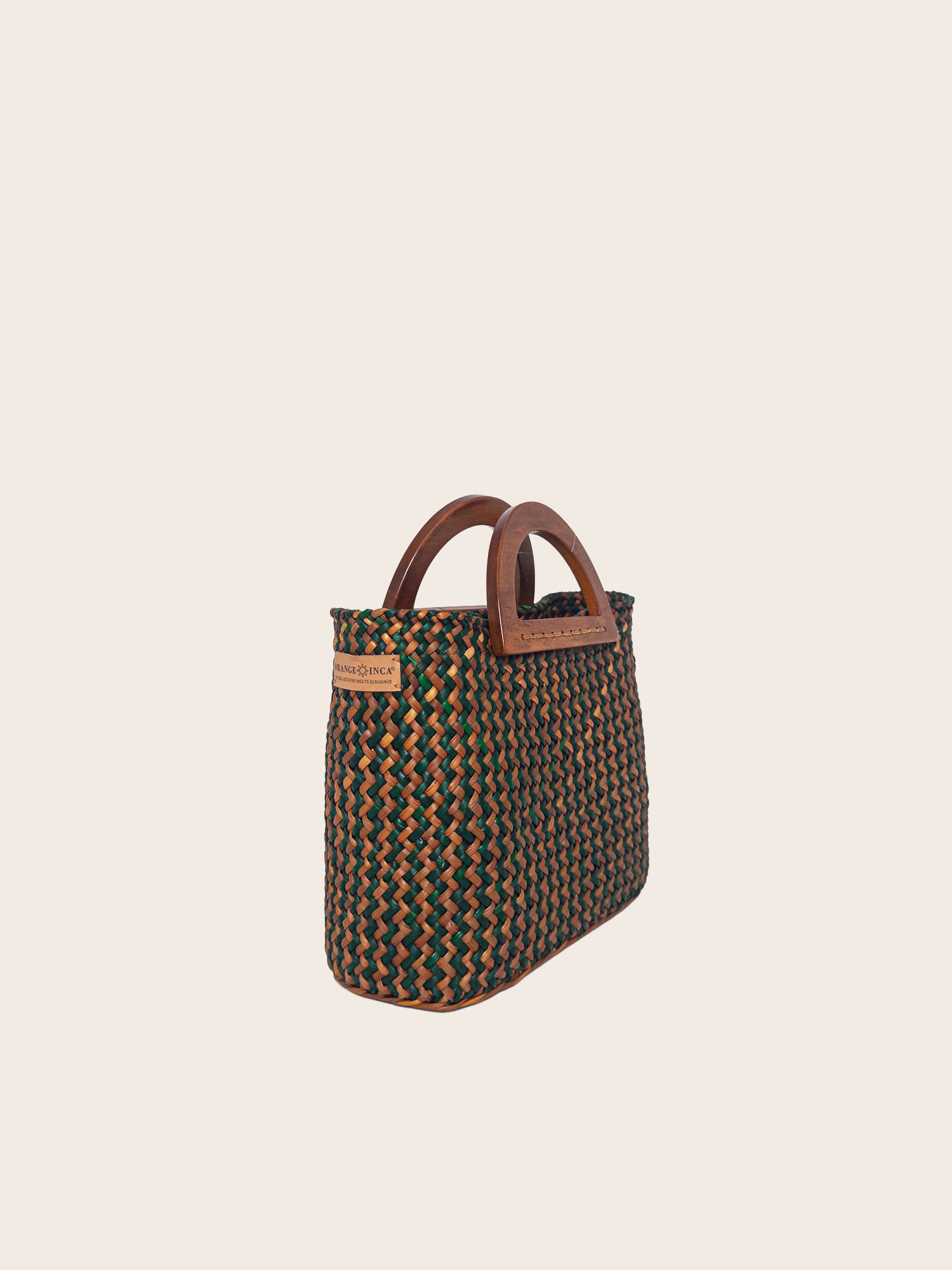The Sophia bag in olive green and camel with wooden handles, showcasing its handwoven texture and stylish design.
