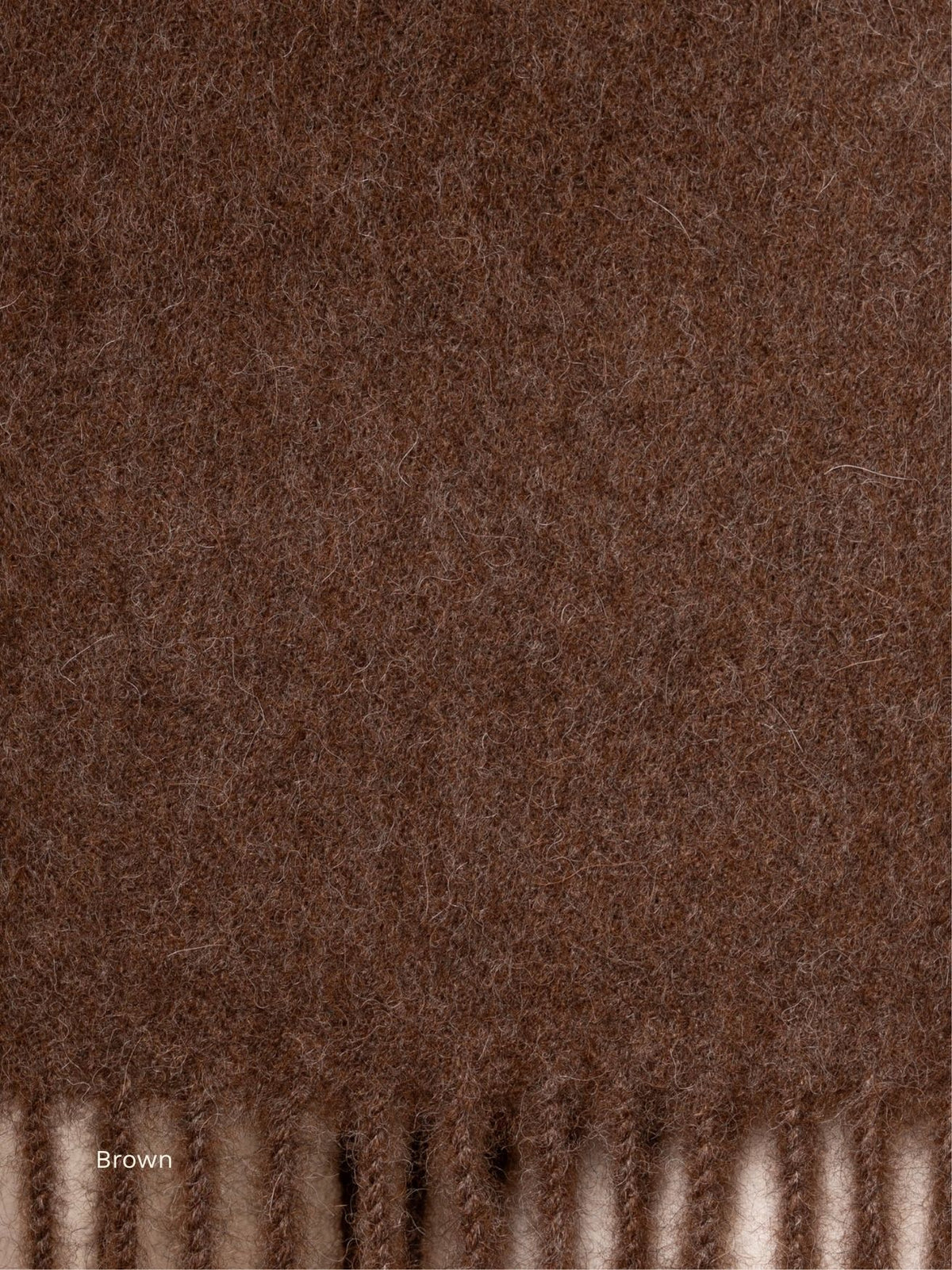Brown undyed baby alpaca scarf, close-up of the natural dark brown fibre and fringe