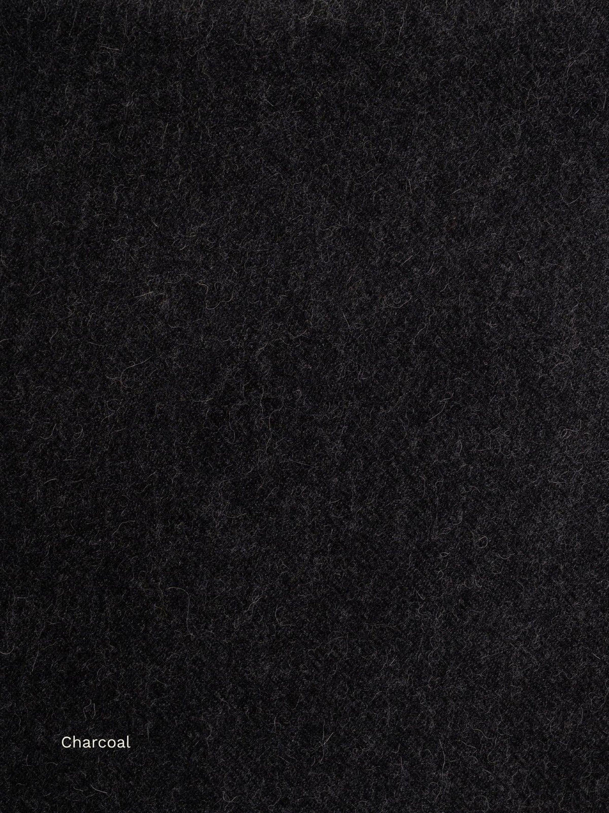 Charcoal undyed baby alpaca scarf, close-up of the dark natural fibre texture