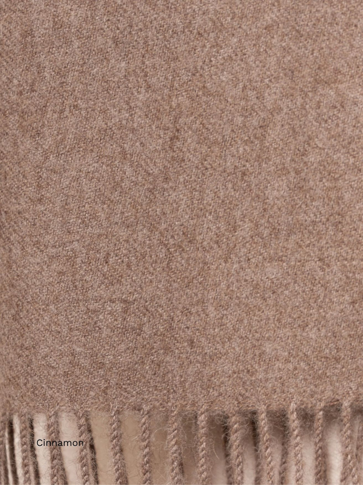 Cinnamon undyed baby alpaca scarf, close-up of the warm taupe fabric and fringe