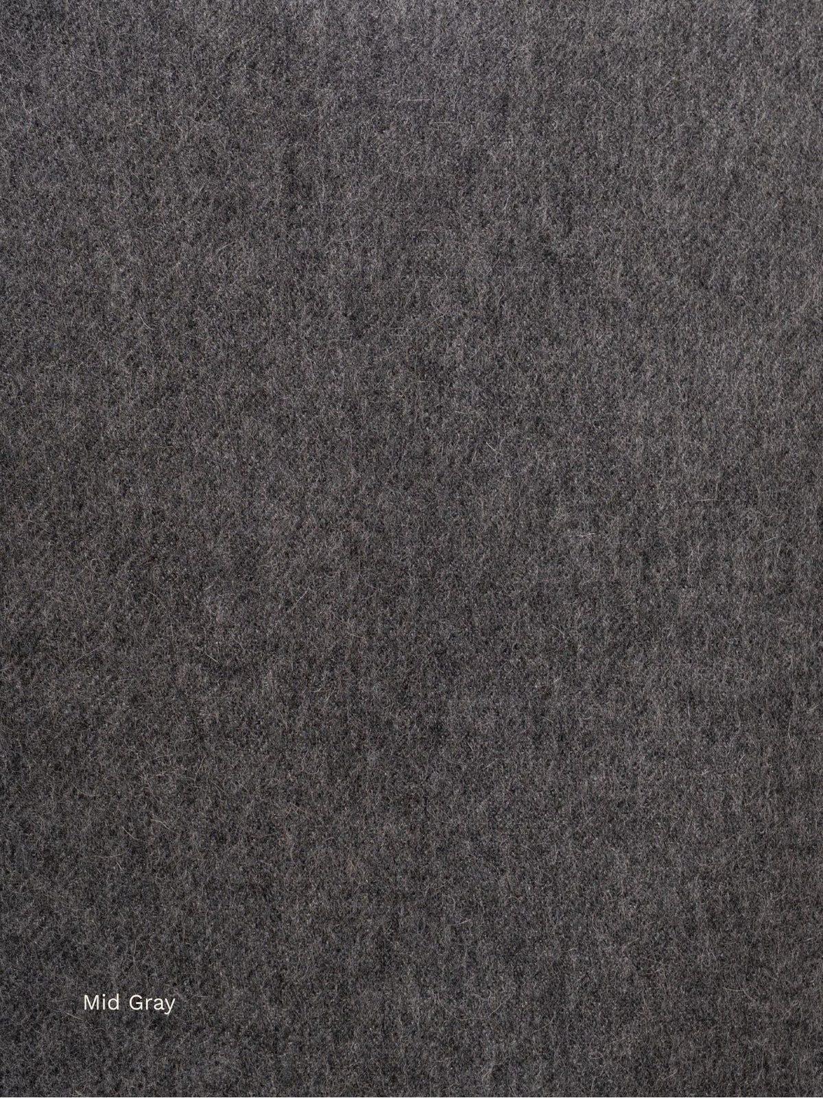 Mid grey undyed baby alpaca scarf, close-up of the natural dark grey fibre texture