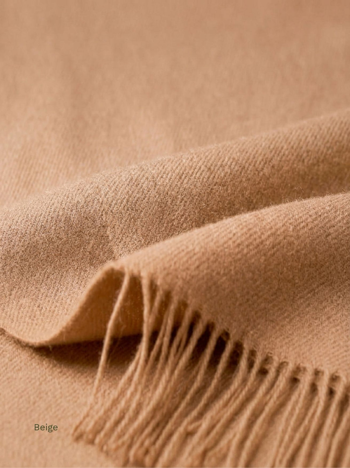 Beige undyed baby alpaca shawl, close-up of the fold and fringe in soft Peruvian alpaca fibre